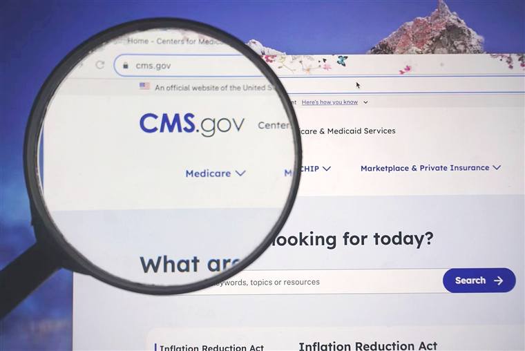 CMS.gov website under a magnifying glass